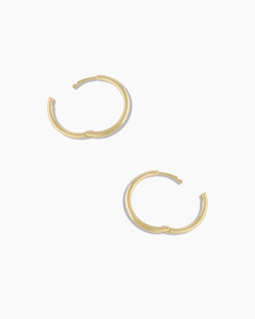 Woman wearing Classic Gold Huggie || option::14K Solid Gold, 11mm