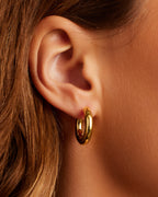 On model Lou Hoops chunky hoops bold hoop earrings || option::18K Gold Plated