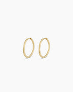 Woman wearing Classic Gold Huggie || option::14K Solid Gold, 15mm