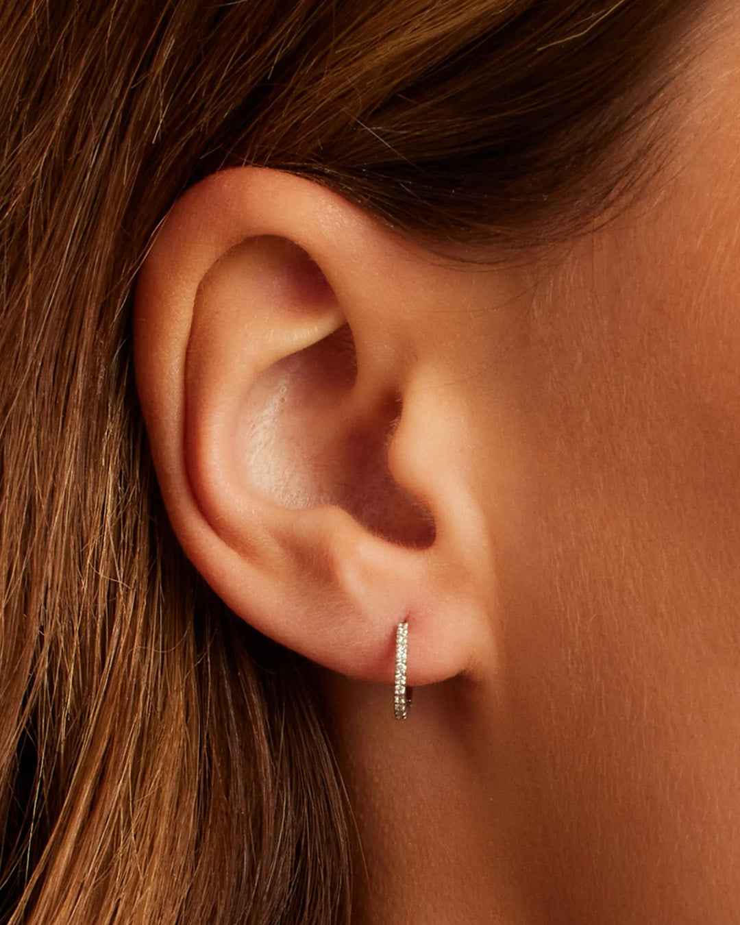 Woman wearing Classic Gold Huggie || option::14K Solid White Gold, 11mm