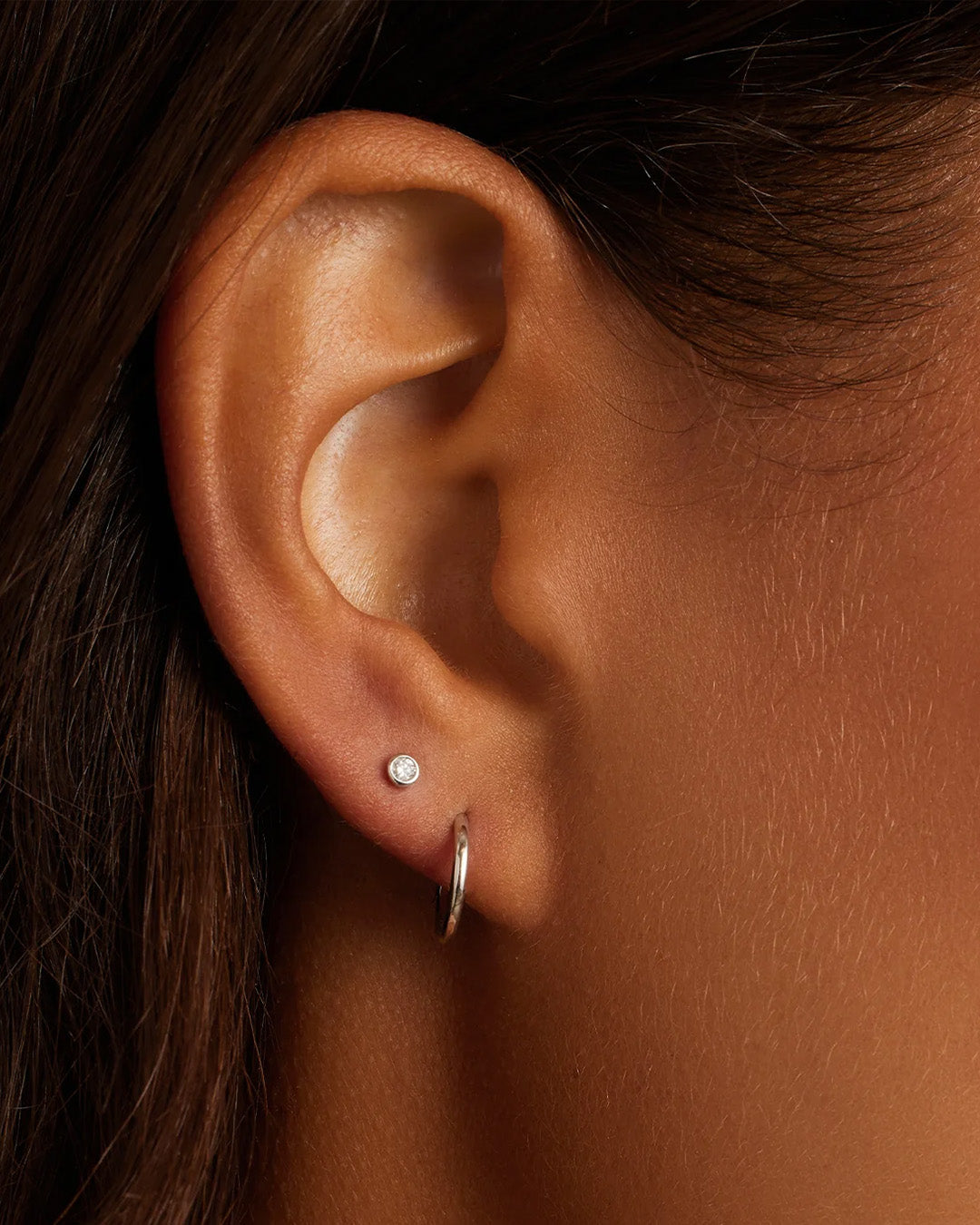 Woman wearing Classic Gold Huggie || option::14K Solid White Gold, 11mm