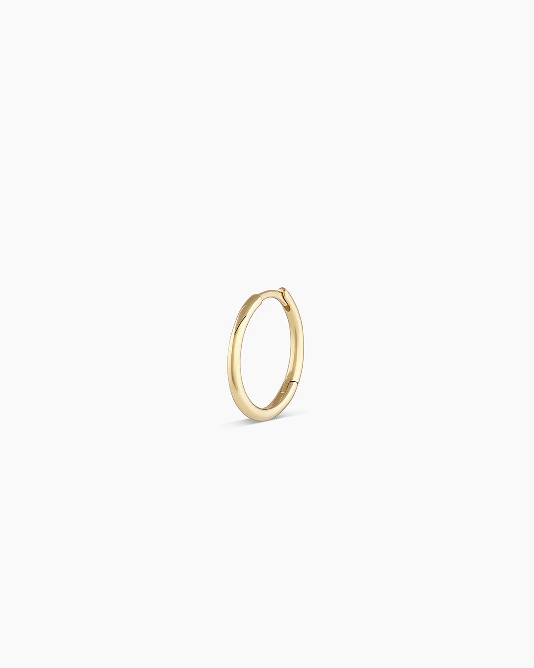 Woman wearing Classic Gold Huggie || option::14K Solid Gold, 13mm