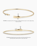 Instructions to wear the cuff: TO OPEN the cuff, gently press the closure button and create a small opening. Opening will be front to back, to slip over your wrist. TO CLOSE, again gently press the closure button and insert the double safety notch. Once fully inserted, release the button to snap/clamp closed. 