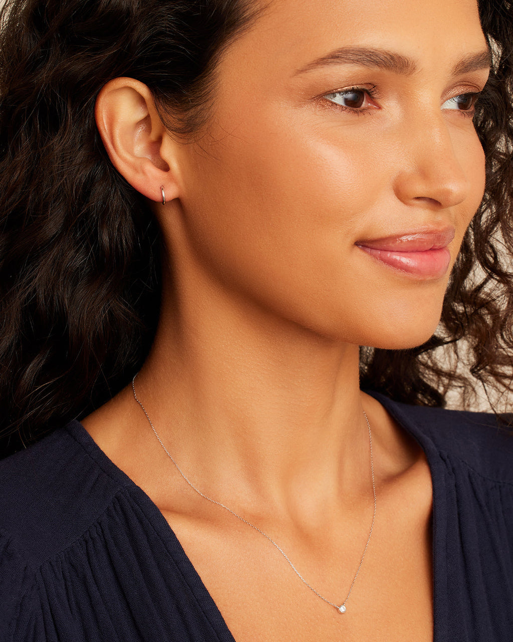 Woman wearing Classic Gold Huggie || option::14K Solid White Gold, 11mm