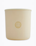 Beige candle with a logo on a white background